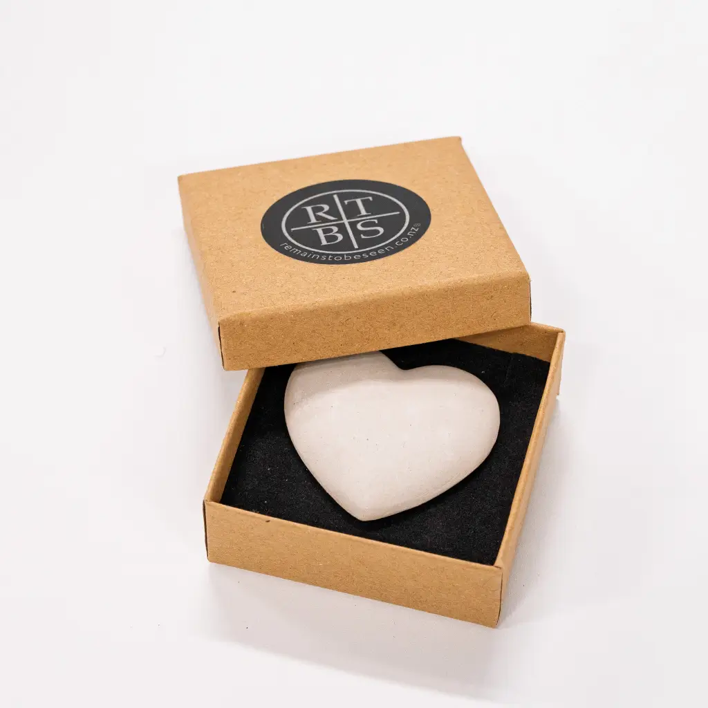 A Love Token heart in its kraft RTBS gift box