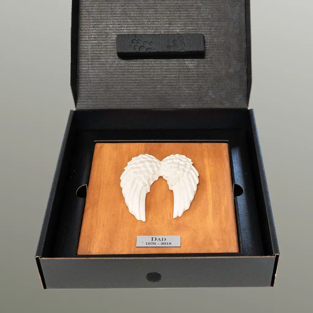 A finished winged memorial presented in its custom RTBS box