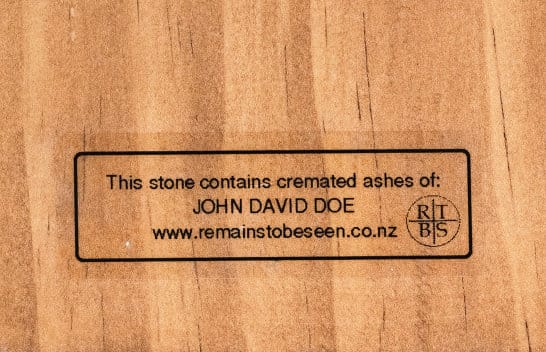 The authenticity ID label engraved on the back of a wooden board — click to enlarge